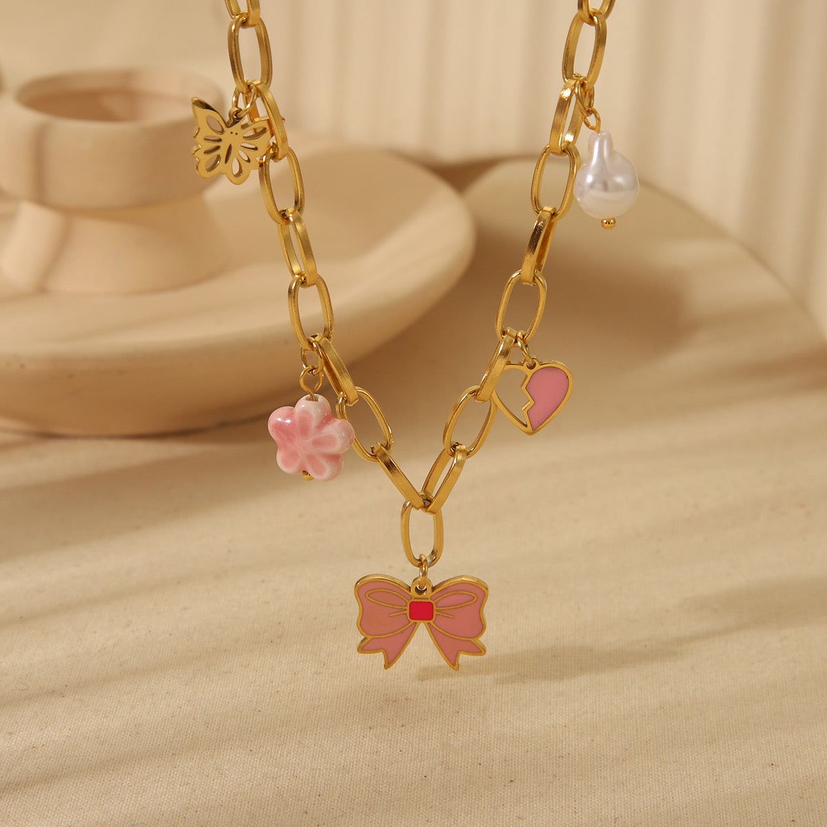 C650 Collar moño rosa acero inoxidable largo 24cm dije 2cm | E M I L I E N