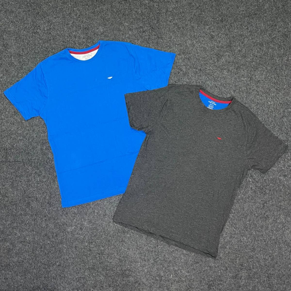 black nike shirt with blue swoosh